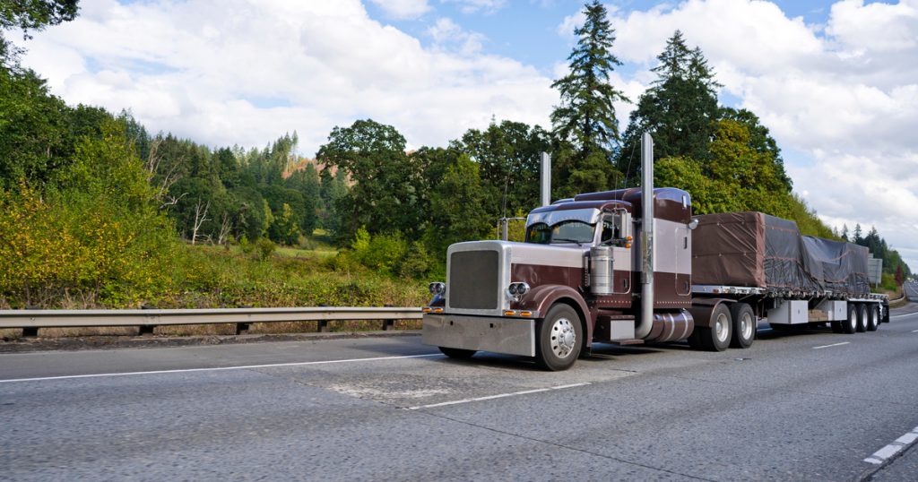 Trucker using new TruckLogics trucking management system features
